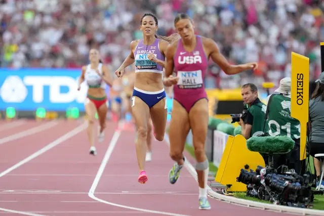 Katarina Johnson-Thompson crosses the line in second to win gold (Martin Rickett/PA)