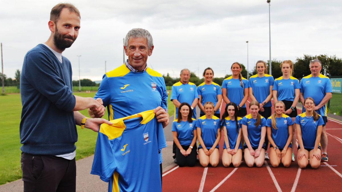 Paddy Ryan of Run Republic presenting Jerseys to Martin Flynn and Tipp Womens Athletics Team